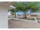 Cozy courtyard with brick pavers, a low brick wall, and views of the surrounding neighborhood at 6019 E Windsor Ave, Scottsdale, AZ 85257