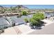 Attractive single-level home featuring a well-manicured front yard and a spacious driveway at 6019 E Windsor Ave, Scottsdale, AZ 85257