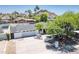 Aerial view of a single-level home showcasing a manicured front yard and a spacious driveway at 6019 E Windsor Ave, Scottsdale, AZ 85257