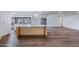 Open-concept kitchen featuring white cabinets, stainless steel appliances, an island and hardwood floors at 6019 E Windsor Ave, Scottsdale, AZ 85257