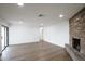Spacious living room with hardwood floors, recessed lighting and fireplace at 6019 E Windsor Ave, Scottsdale, AZ 85257