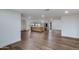 Open concept living room with hardwood floors and kitchen island, recessed lighting and neutral paint at 6019 E Windsor Ave, Scottsdale, AZ 85257