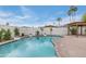Inviting pool area with lush palm trees, landscaped yard and relaxing pergola at 6019 E Windsor Ave, Scottsdale, AZ 85257