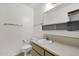 Bathroom features neutral cabinets with chrome hardware and white walls at 7319 E Northland Dr # 5, Scottsdale, AZ 85251