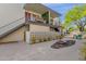 Exterior view showcasing the well-maintained facade with a view of a decorative rock garden at 7319 E Northland Dr # 5, Scottsdale, AZ 85251