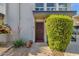 Charming front entrance with a secure screen door and decorative landscaping at 7319 E Northland Dr # 5, Scottsdale, AZ 85251