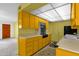 Retro kitchen featuring unique yellow cabinetry and ample counter space at 7319 E Northland Dr # 5, Scottsdale, AZ 85251