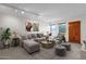 Bright living room featuring a large sectional sofa and stylish decor at 7319 E Northland Dr # 5, Scottsdale, AZ 85251