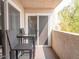 Cozy balcony features a table and chairs perfect for relaxing outdoors at 7474 E Earll Dr # 311, Scottsdale, AZ 85251