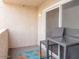 Private balcony with outdoor seating and sliding glass door at 7474 E Earll Dr # 311, Scottsdale, AZ 85251