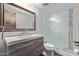 Updated bathroom features a modern vanity, large mirror, and a glass-enclosed shower at 7474 E Earll Dr # 311, Scottsdale, AZ 85251