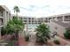 Inviting courtyard view showcasing the community pool, lush landscaping, and outdoor seating at 7474 E Earll Dr # 311, Scottsdale, AZ 85251