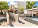 Front entrance to the community with accessible ramp and well-maintained landscaping at 7474 E Earll Dr # 311, Scottsdale, AZ 85251