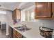 Well-lit kitchen area with a stainless steel sink and cabinets at 7474 E Earll Dr # 311, Scottsdale, AZ 85251