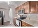Functional kitchen featuring stainless steel appliances and ample cabinet space at 7474 E Earll Dr # 311, Scottsdale, AZ 85251