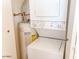 Conveniently located laundry area with stacked washer, dryer and water heater at 7474 E Earll Dr # 311, Scottsdale, AZ 85251
