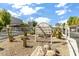 Community entrance signage with desert landscaping, rocks and cacti at 7474 E Earll Dr # 311, Scottsdale, AZ 85251