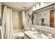The bathroom features a tub with a shower, updated fixtures, and marble vanity at 7625 E Camelback Rd # A249, Scottsdale, AZ 85251