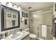 Bathroom featuring marble vanity, frosted glass shower, and framed artwork at 7625 E Camelback Rd # A249, Scottsdale, AZ 85251