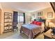This bedroom features a decorative bookcase, cozy chair and window with natural light at 7625 E Camelback Rd # A249, Scottsdale, AZ 85251