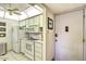 A fully-equipped kitchen with white cabinetry and appliances, complemented by a bright ceiling fixture at 7625 E Camelback Rd # A249, Scottsdale, AZ 85251