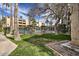 Community pool offers shaded tables, fenced perimeter, and views of the building at 7625 E Camelback Rd # A249, Scottsdale, AZ 85251