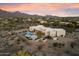 Aerial view showcasing the private estate with resort-style pool, mountain views, and desert landscape at 9022 E Diamond Rim Dr, Scottsdale, AZ 85255