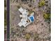Aerial view of estate showcasing privacy, desert landscape, private pool, and circular driveway at 9022 E Diamond Rim Dr, Scottsdale, AZ 85255