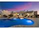 Backyard pool and spa with desert landscape design are the focus of this exterior shot at 9022 E Diamond Rim Dr, Scottsdale, AZ 85255
