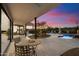 Backyard featuring neutral tiled patio, outdoor furniture and views of desert landscaping at 9022 E Diamond Rim Dr, Scottsdale, AZ 85255