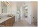 Bathroom featuring marble countertop vanity with wooden drawers and cabinets at 9022 E Diamond Rim Dr, Scottsdale, AZ 85255