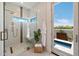 This bathroom features a walk-in shower with a glass wall and access to the pool at 9022 E Diamond Rim Dr, Scottsdale, AZ 85255