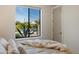 Bedroom with serene views of desert landscape from window creates peaceful private retreat at 9022 E Diamond Rim Dr, Scottsdale, AZ 85255