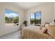 Bright bedroom with serene desert views from the large window creates a peaceful private retreat at 9022 E Diamond Rim Dr, Scottsdale, AZ 85255
