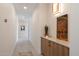 Bright hallway features custom millwork and designer lighting, enhancing the home's modern appeal at 9022 E Diamond Rim Dr, Scottsdale, AZ 85255