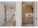 Hallway with sightlines into other rooms plus a built-in storage with countertop at 9022 E Diamond Rim Dr, Scottsdale, AZ 85255