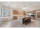 Gourmet kitchen with large island, breakfast bar, stainless appliances, and modern lighting at 9022 E Diamond Rim Dr, Scottsdale, AZ 85255