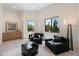 Inviting living room featuring two armchairs, recessed lighting, and expansive windows providing natural light and views at 9022 E Diamond Rim Dr, Scottsdale, AZ 85255