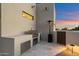 Outdoor kitchen featuring stainless steel appliances and counter under a neutral tone awning at 9022 E Diamond Rim Dr, Scottsdale, AZ 85255