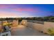 Open rooftop deck with views and seating, illuminated by outdoor lighting and desert landscaping at 9022 E Diamond Rim Dr, Scottsdale, AZ 85255