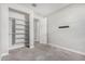 Bright bedroom with carpet, closet, and a wall-mounted TV bracket at 10352 E Sebring Ave, Mesa, AZ 85212