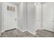 Bright entryway featuring white doors, neutral walls and stylish gray wood-look flooring at 10352 E Sebring Ave, Mesa, AZ 85212