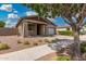Inviting single-Gathering home featuring desert landscaping, covered entryway and attached garage at 10352 E Sebring Ave, Mesa, AZ 85212
