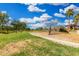 Community playground with modern climbing structures and a spacious green area for outdoor activities at 10352 E Sebring Ave, Mesa, AZ 85212