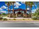 A modern ramada with stone pillars is surrounded by palm trees, a central gathering place at 10352 E Sebring Ave, Mesa, AZ 85212