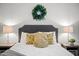 Cozy bedroom features a comfortable bed, neutral paint and decorative pillows at 10617 W Daley Ln, Peoria, AZ 85383