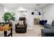 Comfortable rec room with comfortable seating, with neutral decor and bright open lighting at 10617 W Daley Ln, Peoria, AZ 85383