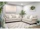 Cozy living room with two couches, an area rug, and decor providing a comfortable, welcoming space at 10617 W Daley Ln, Peoria, AZ 85383