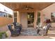 Relaxing covered patio with comfortable seating and stylish decor at 10617 W Daley Ln, Peoria, AZ 85383
