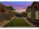 Charming backyard with manicured lawn, pavers, and outdoor seating, perfect for relaxing and entertaining at 10738 W Rowel Rd, Peoria, AZ 85383